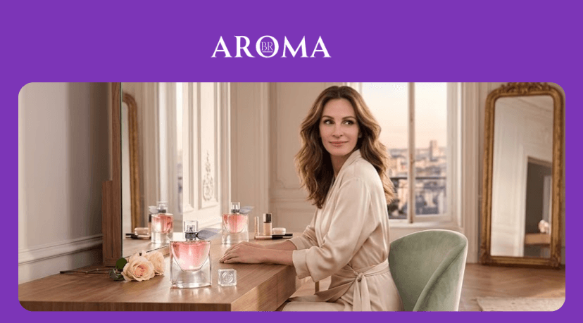 Mulher elegante sentada à mesa com perfumes femininos em ambiente sofisticado e iluminado - Aromabr